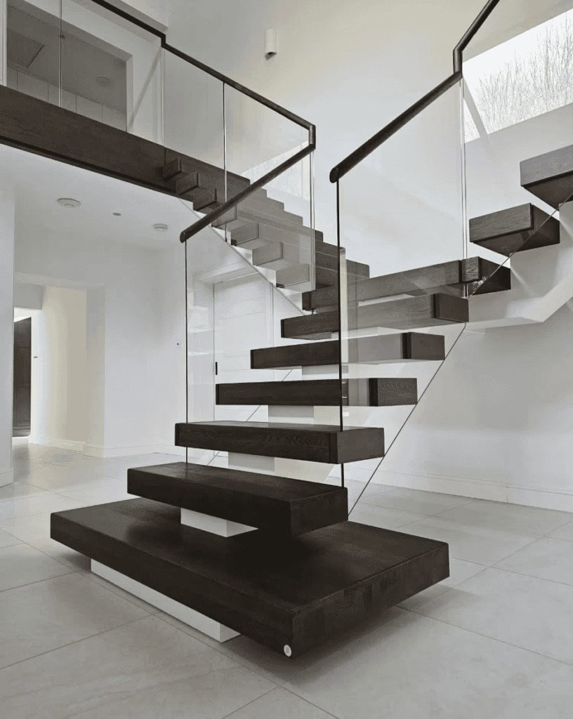 Floating dark oak staircase with a glass balustrade