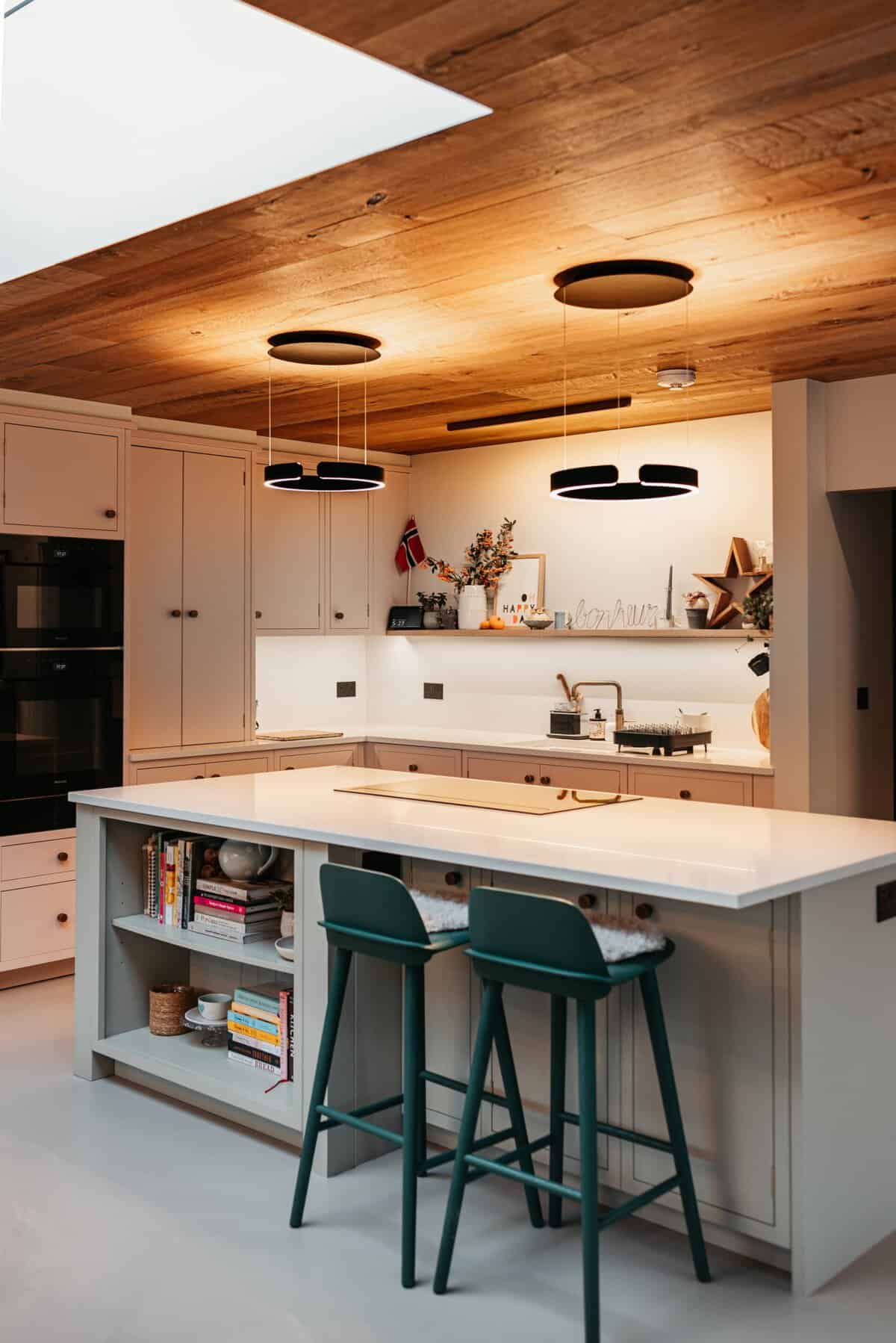 Finished kitchen with a timber ceiling and pendant lighting